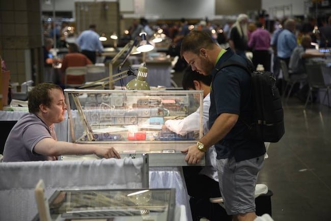 man at coin show